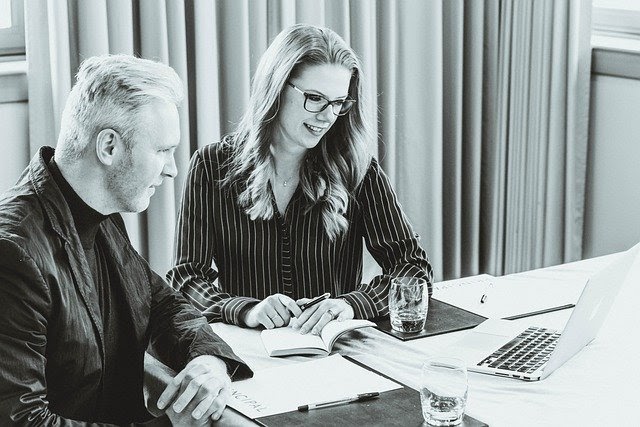 Man and woman on laptop